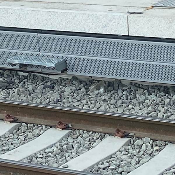 Sound absorbing train platform